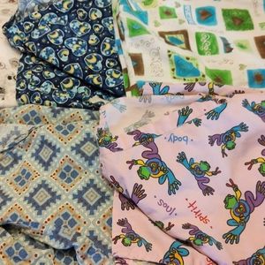 Bundle of four scrub tops size 2XL.